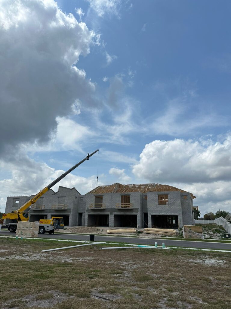 Large crane raising trusses